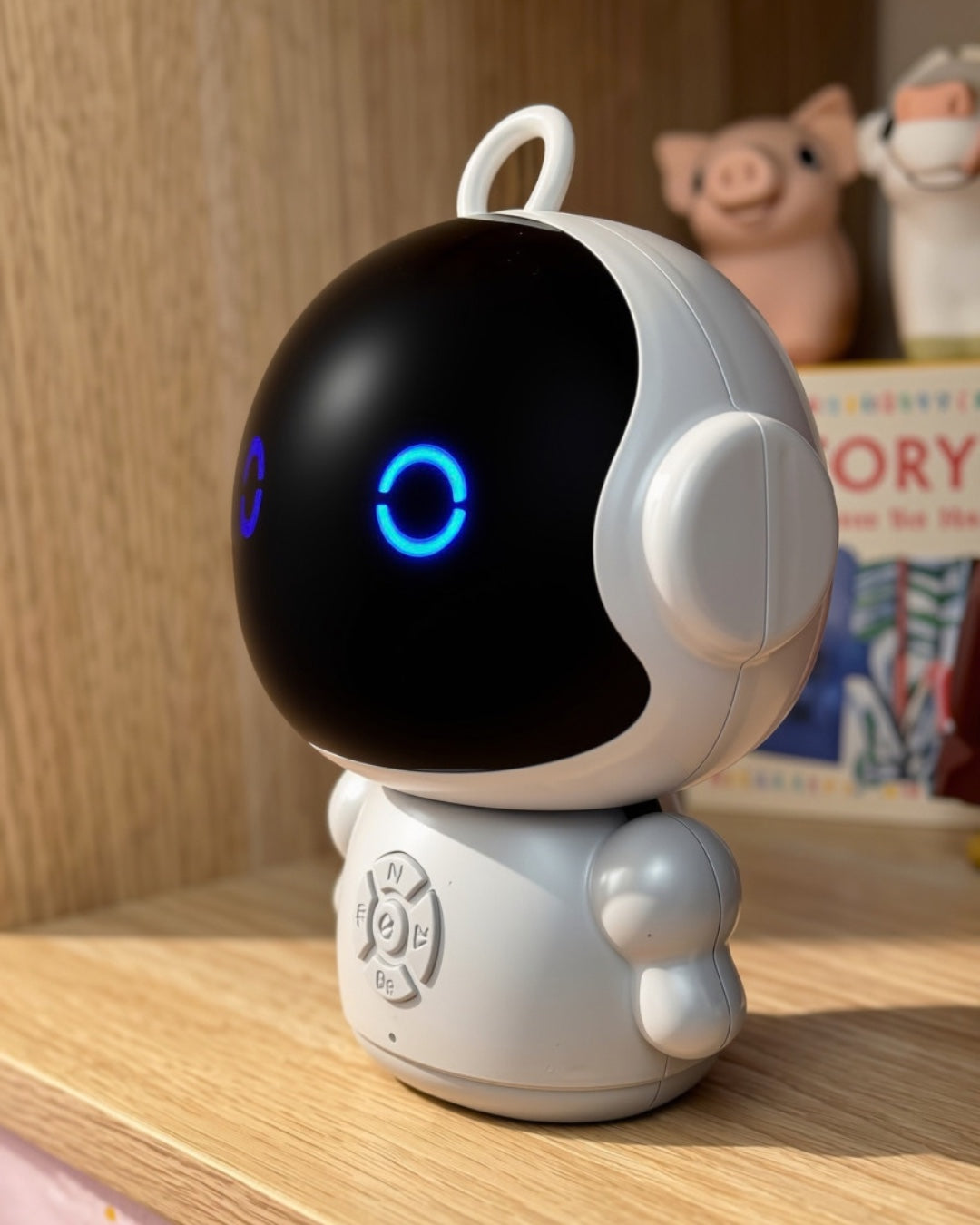 Otto photographed from the side, showing the domed face and the control pad